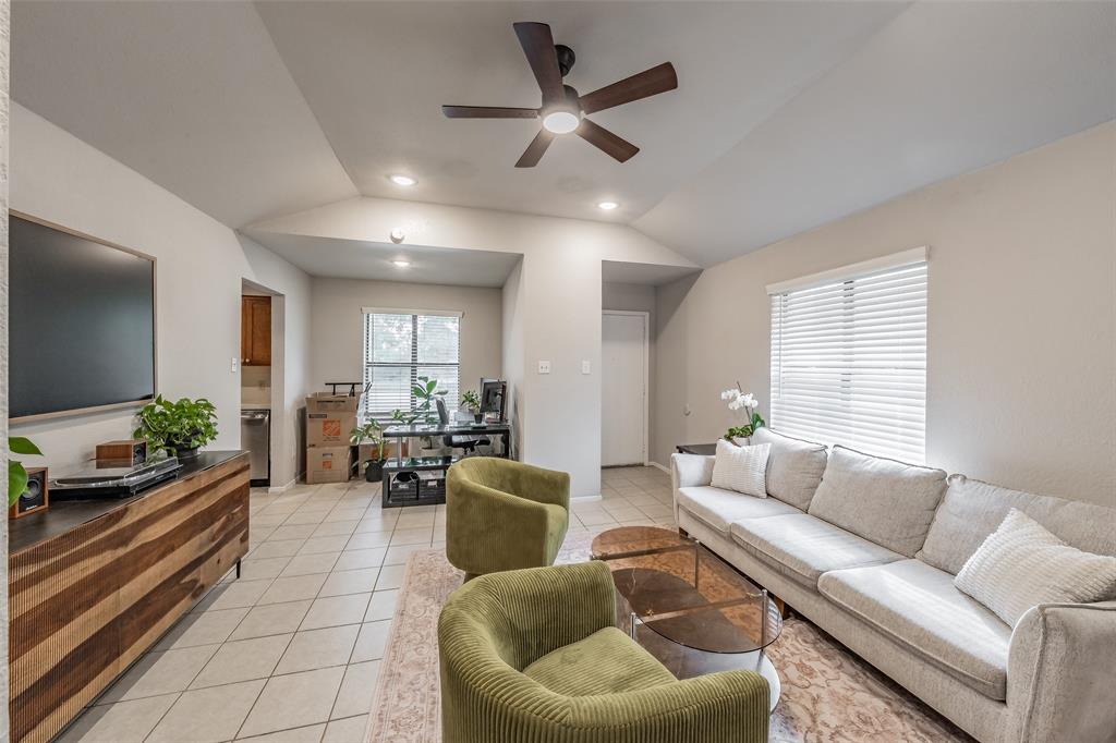 1128 Vaulted ceilings, neutral wall tones, recessed lighting, multi-blade ceiling fan, and ceramic tile flooring 1128 Vaulted ceilings, neutral wall tones, recessed lighting, multi-blade ceiling fan, and ceramic tile flooring