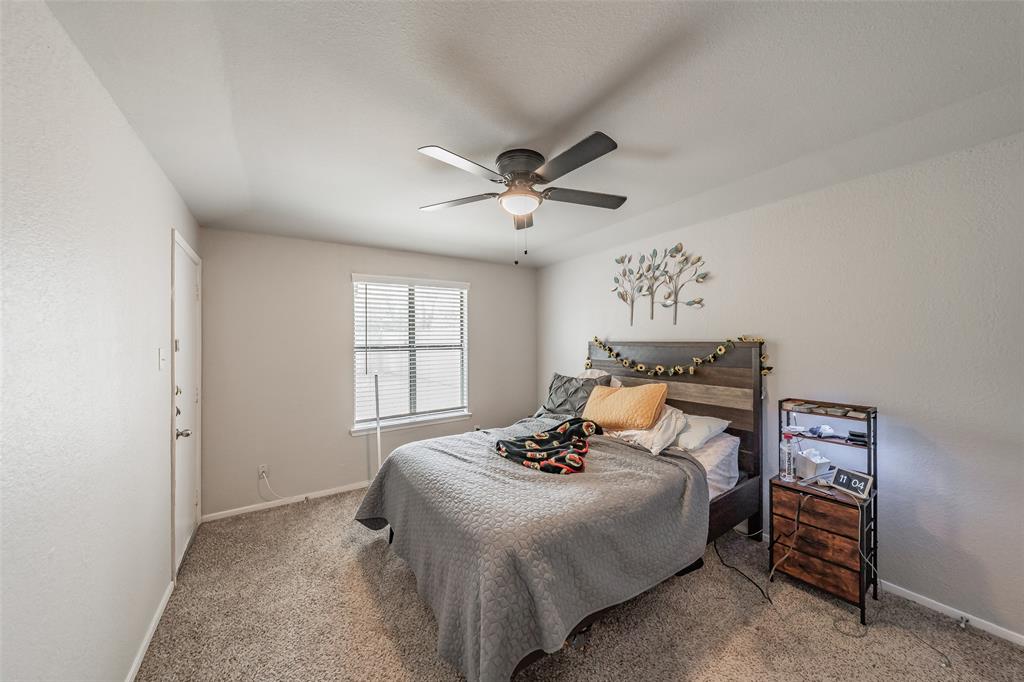 1126 Room featuring neutral wall tones, wall-to-wall carpeting, a multi-blade ceiling fan with integrated lighting, and a window with horizontal blinds