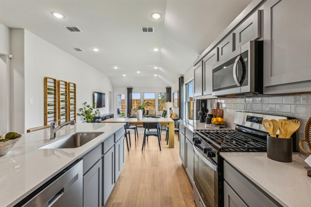 Kitchen in the Turquoise home plan – REPRESENTATIVE PHOTO