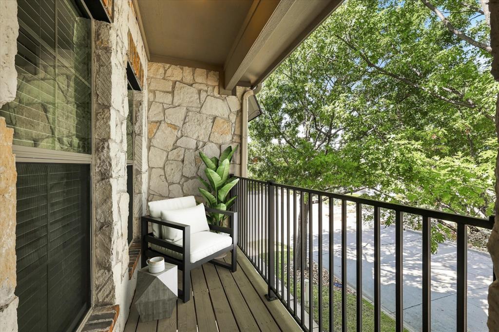 Step outside onto your private covered balcony. Enjoy the shade and the breeze from the trees. Virtual Staging.