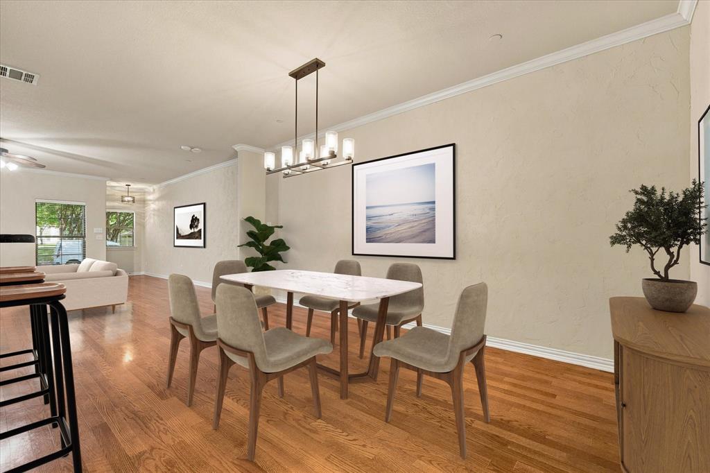 Imagine dinner parties and holiday gatherings in this spacious dining area with new chandelier and room for a large table. Virtual Staging.