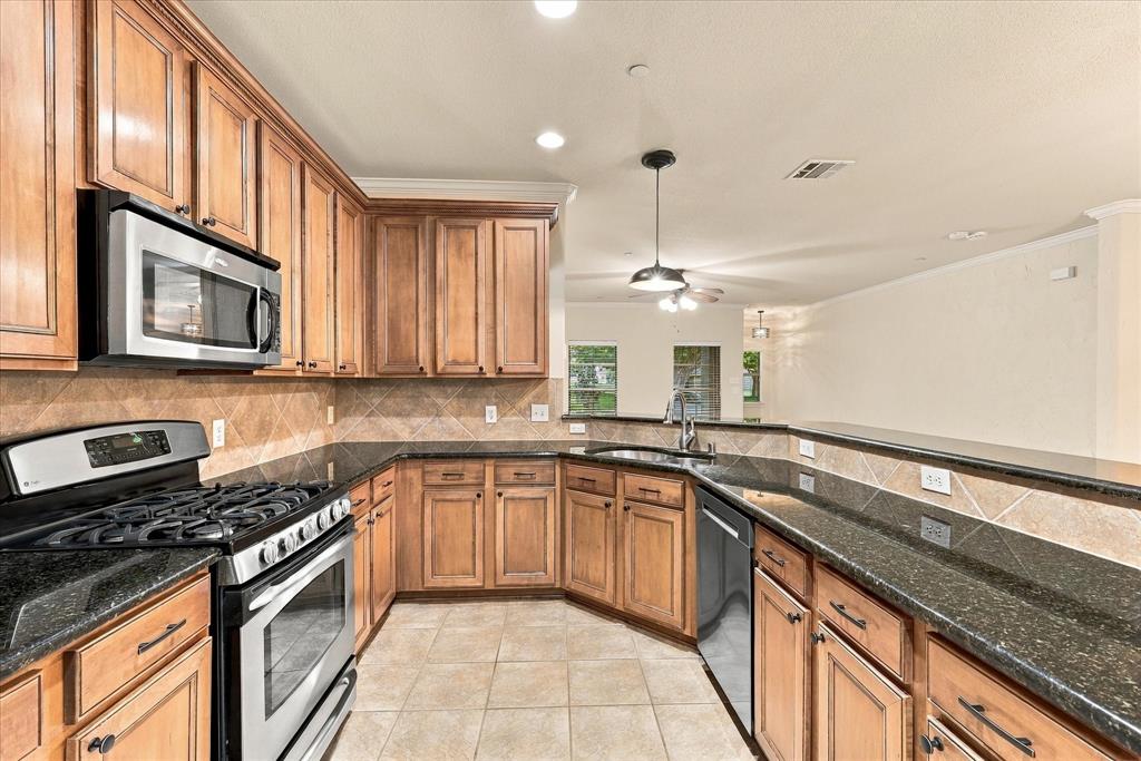 Thoughtfully designed kitchen with everything within reach, including a NEW garbage disposal.