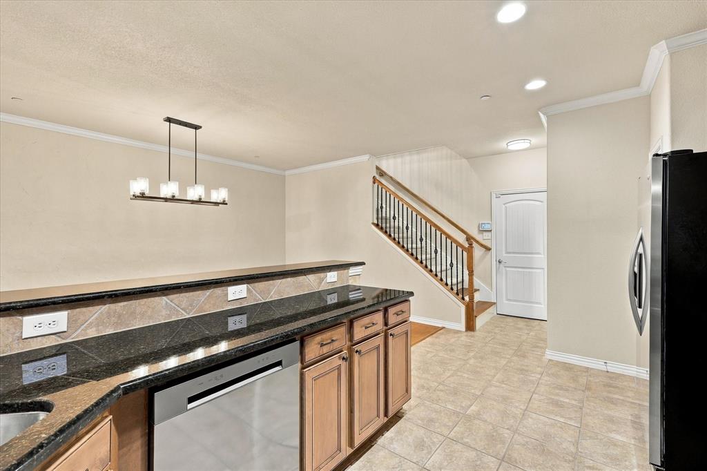 A NEW dishwasher and a stunning granite serving bar make meal prep and cleanup a breeze!