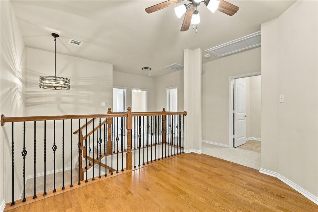 A versatile upstairs flex space ready to fit your lifestyle! Create a game room, home office, hobby room or personal fitness studio.
