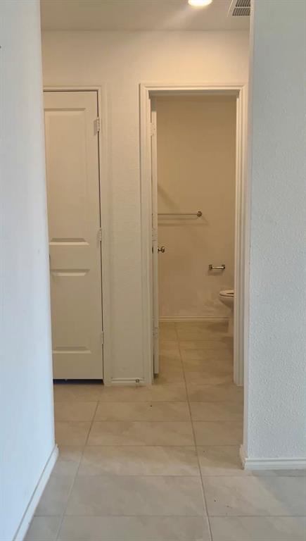 Tile flooring, interior solid-core doors, and chrome-finish hardware