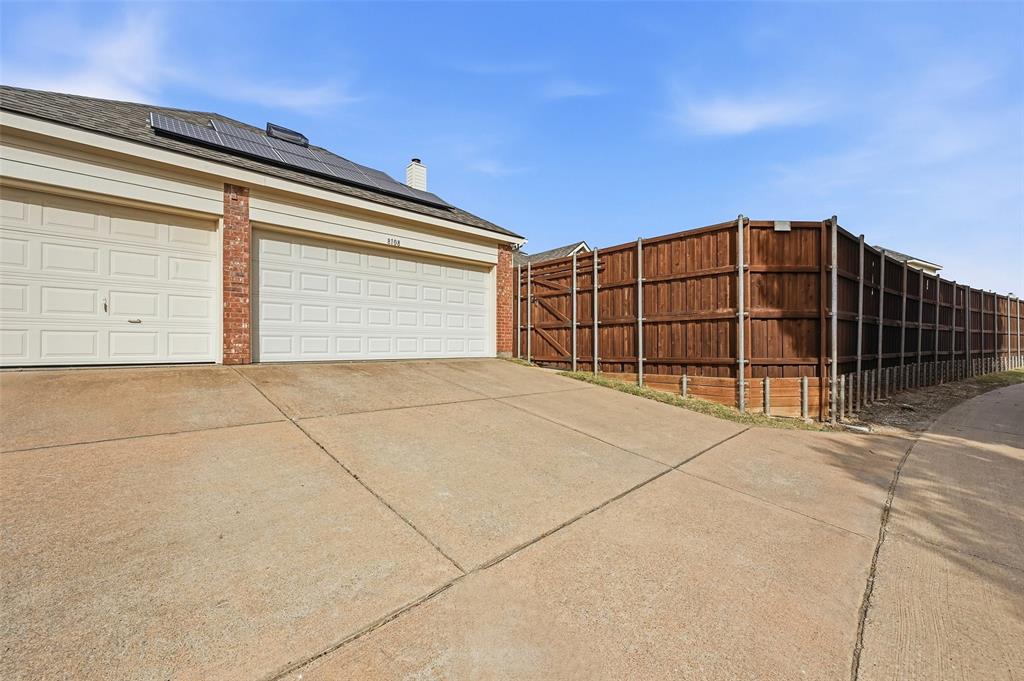 3 car garage with private alley entrance and extra parking