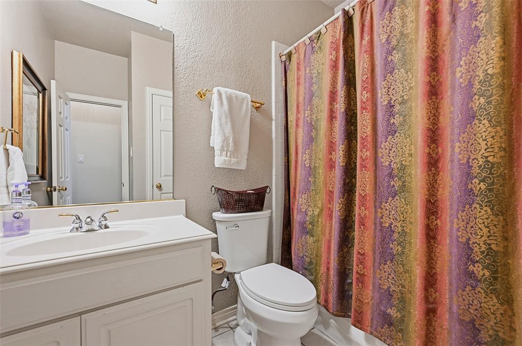 Downstairs full bath located next to the 2nd bedroom and office