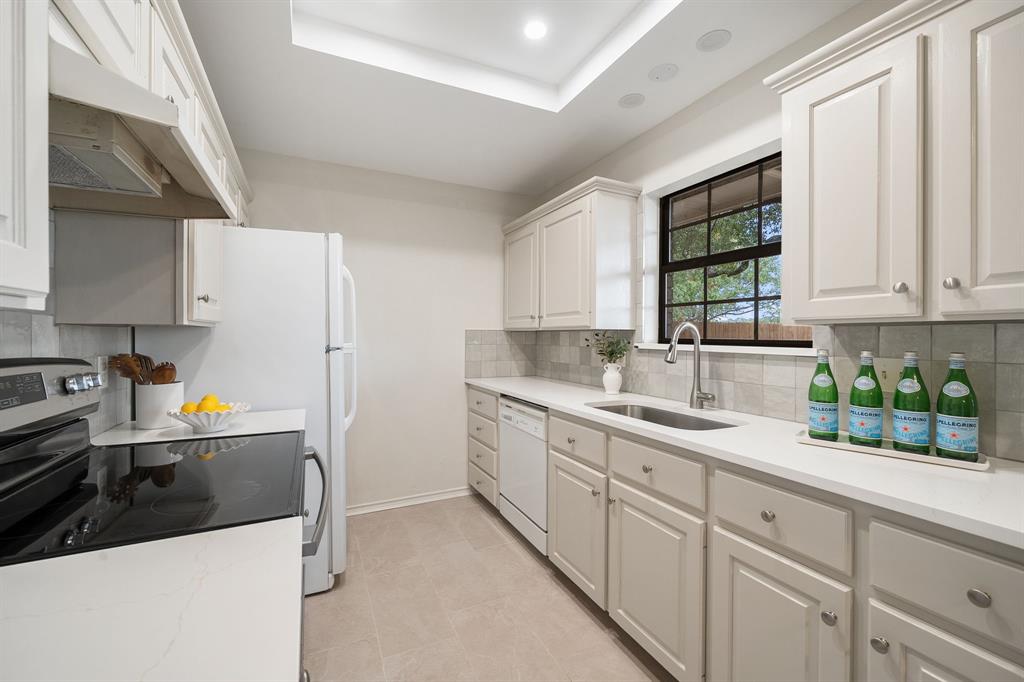 Kitchen with quartz counters and beautiful backsplash Kitchen with quartz counters and beautiful backsplash