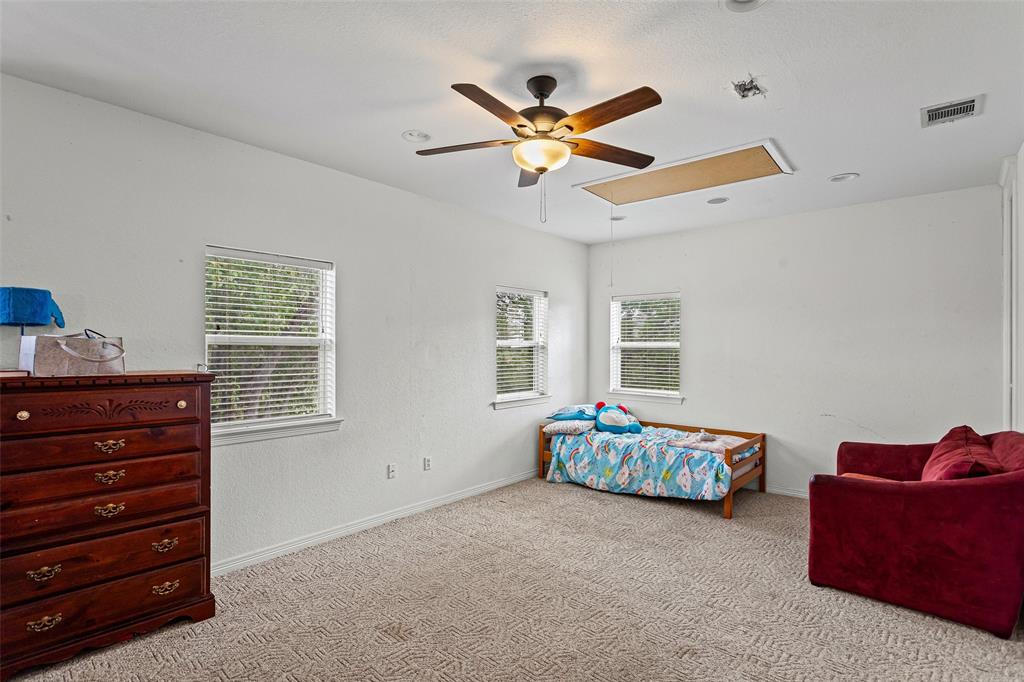 Interior space featuring neutral wall-to-wall carpeting, recessed lighting, and a multi-blade ceiling fan with an integrated light fixture