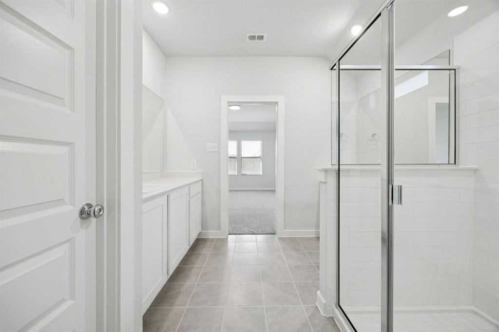 Primary Bathroom in the Heisman home plan – REPRESENTATIVE PHOTO
