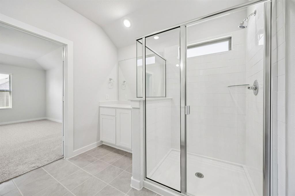 Primary Bathroom in the Heisman home plan – REPRESENTATIVE PHOTO