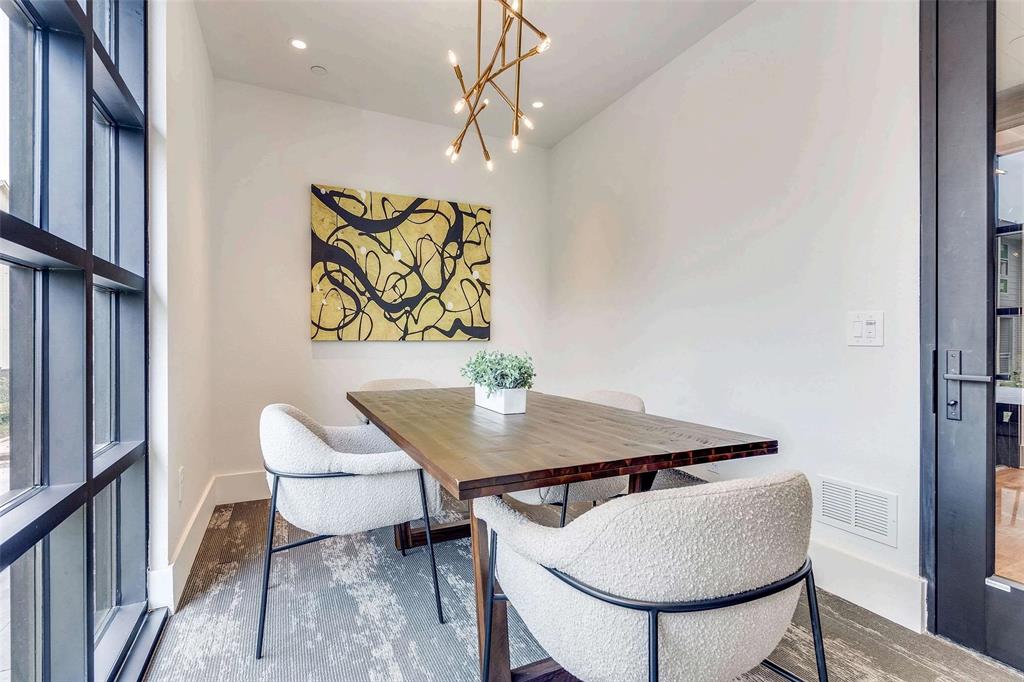 Dining area featuring a chandelier and recessed lighting