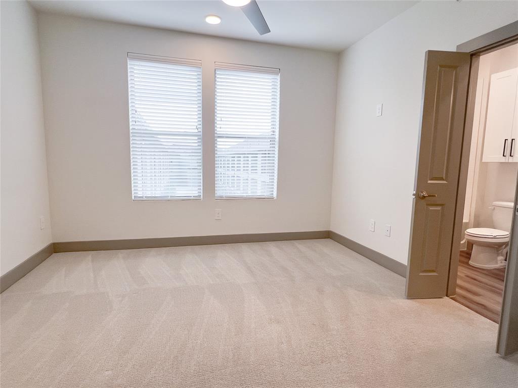 Spare room with light carpet and recessed lighting
