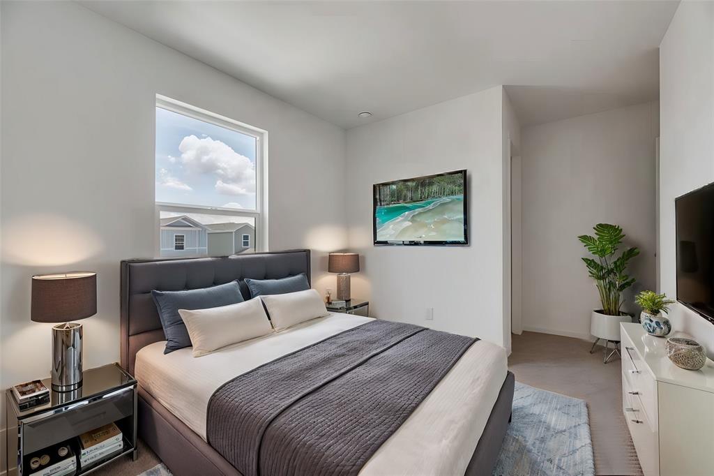Neutral-toned room featuring a single-hung window, light-colored walls, and carpeting