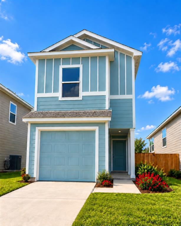 Two-story exterior featuring board-and-batten and lap siding, a single-car garage, and a concrete driveway