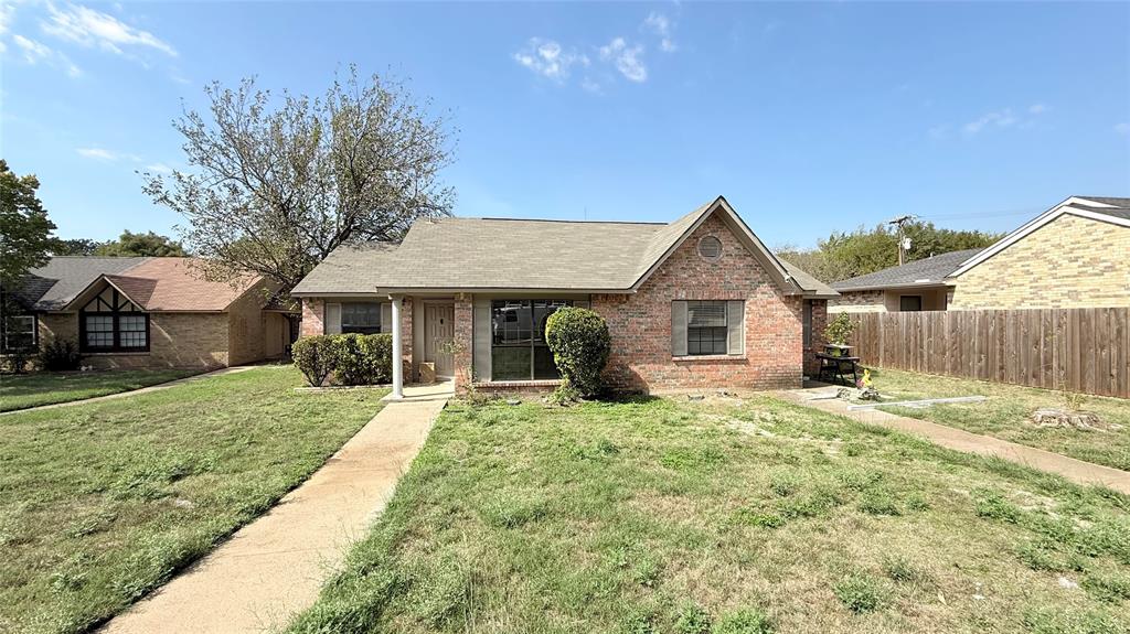 Single-story brick exterior featuring a covered front porch, gabled roofline, concrete walkway, and shuttered windows Single-story brick exterior featuring a covered front porch, gabled roofline, concrete walkway, and shuttered windows