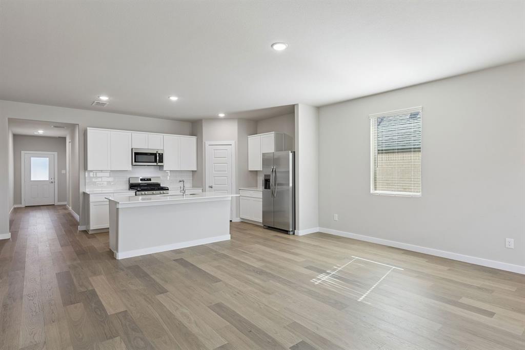 Kitchen and Dining Room in the Holden home plan – REPRESENTATIVE PHOTO