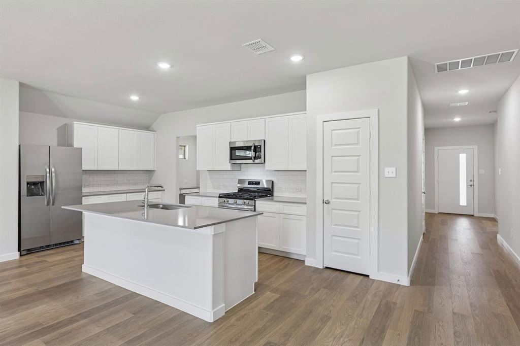 Kitchen in the Harrison home plan – REPRESENTATIVE PHOTO