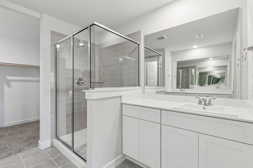 Primary Bathroom in the Harrison home plan – REPRESENTATIVE PHOTO