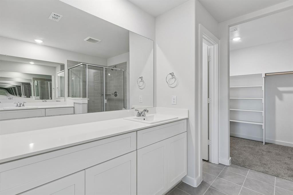 Primary Bathroom in the Harrison home plan – REPRESENTATIVE PHOTO