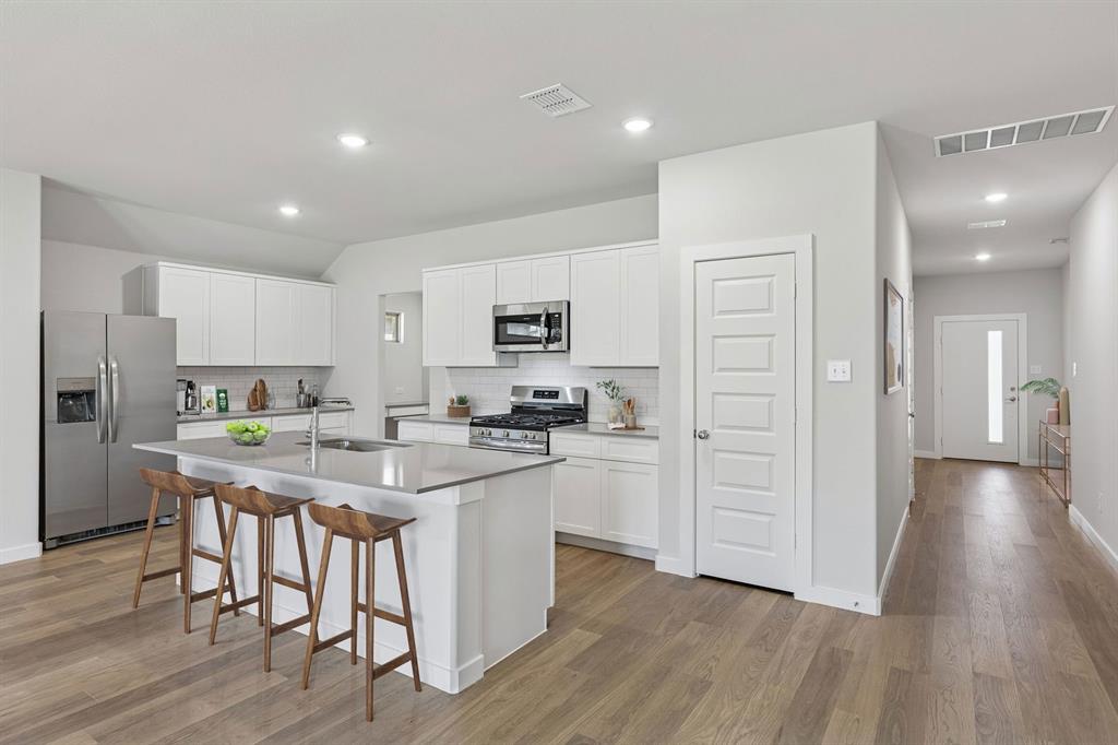 Kitchen in the Harrison home plan – REPRESENTATIVE PHOTO