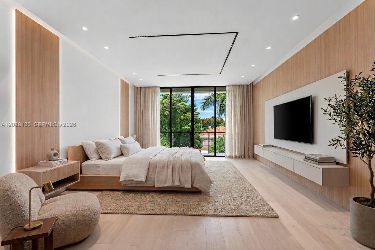 Primary Bedroom. Disclaimer: Several photographs presented in this listing contain digitally added furniture, artwork, and decor. These virtually staged images are intended solely for illustrative purposes.