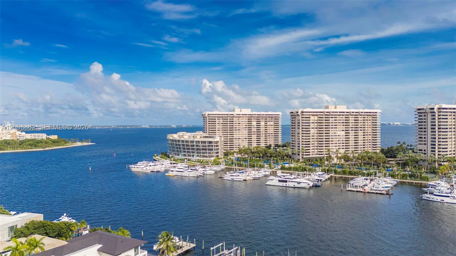 Waterfront location featuring a deep-water marina, multiple high-rise structures, and expansive bay exposure