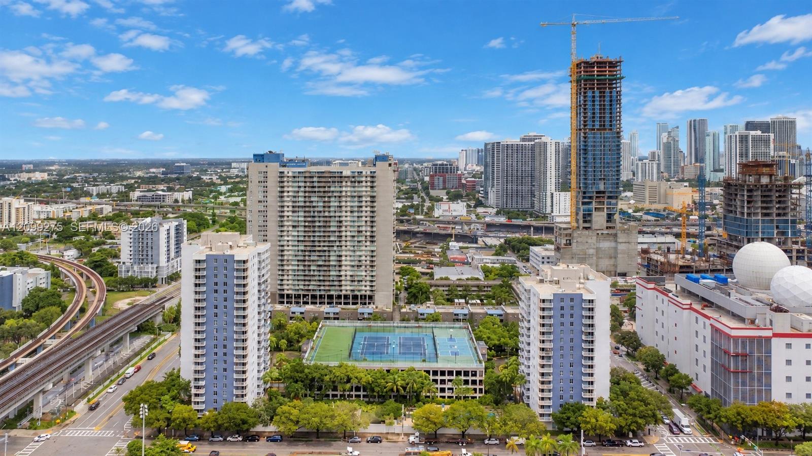 Panoramic skyline views showcasing Miamis vibrant urban landscape, with high-rise residences, ongoing new developments, and convenient access to public transportation.