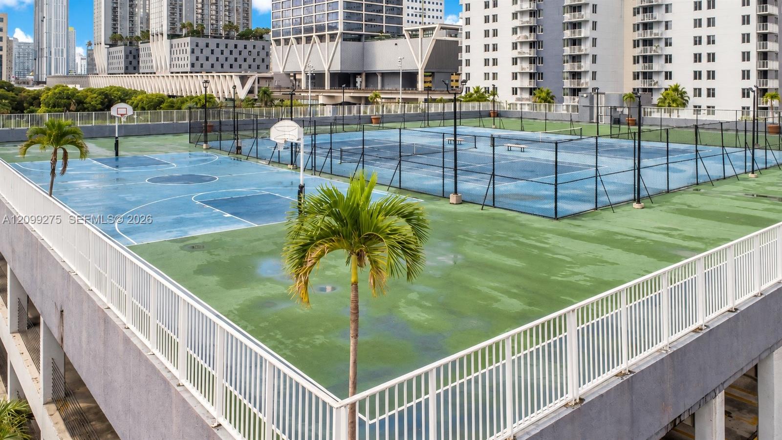 Enjoy an active lifestyle with outdoor basketball and tennis courts, surrounded by tropical landscaping and impressive city views.