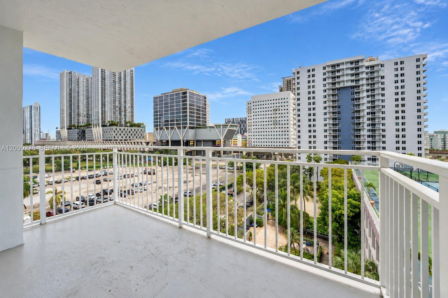 Spacious balcony overlooking downtown Miami skyline.