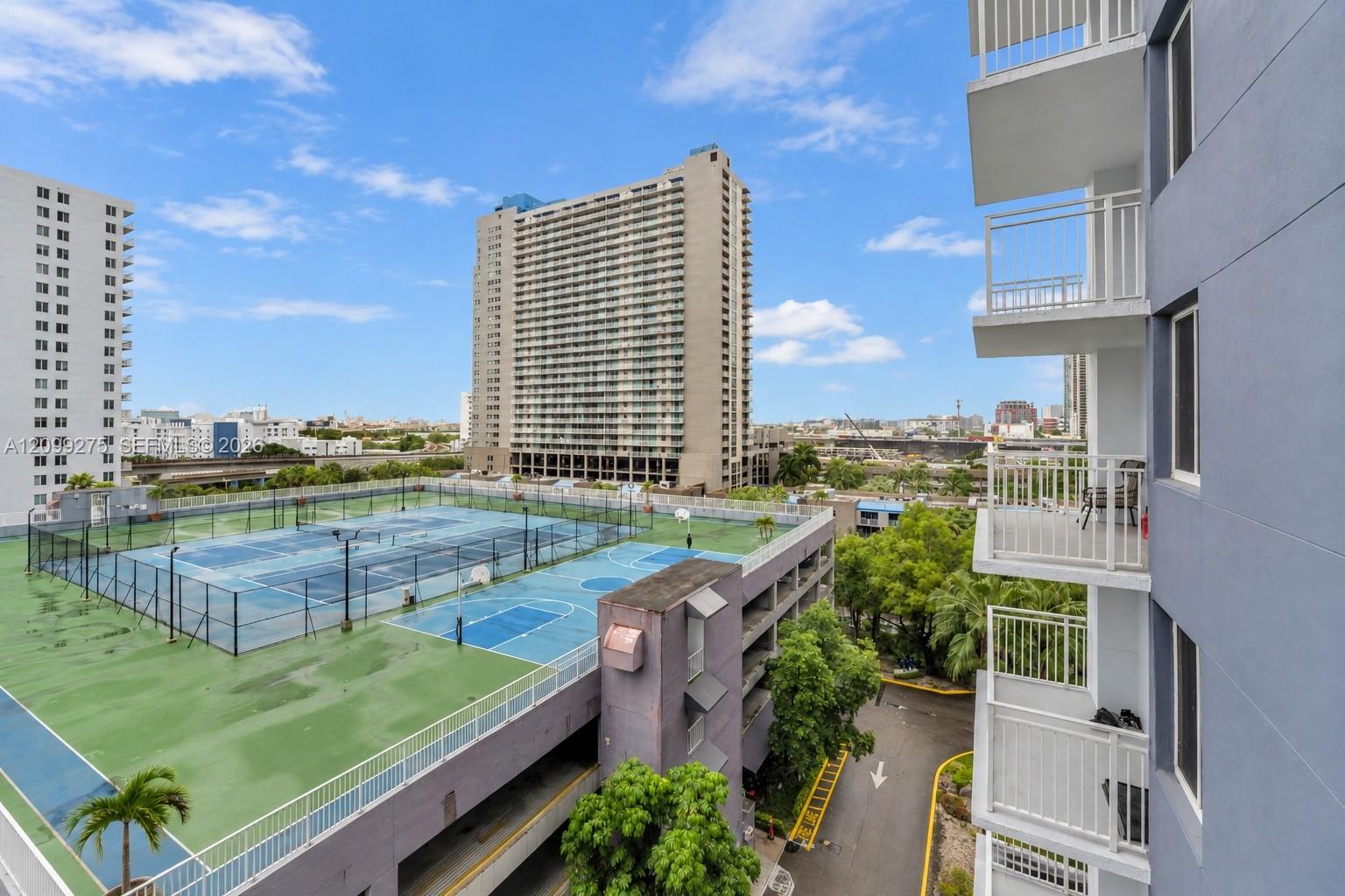 Enjoy expansive city views overlooking the communitys tennis and basketball courts, lush greenery, and surrounding high-rise buildings.