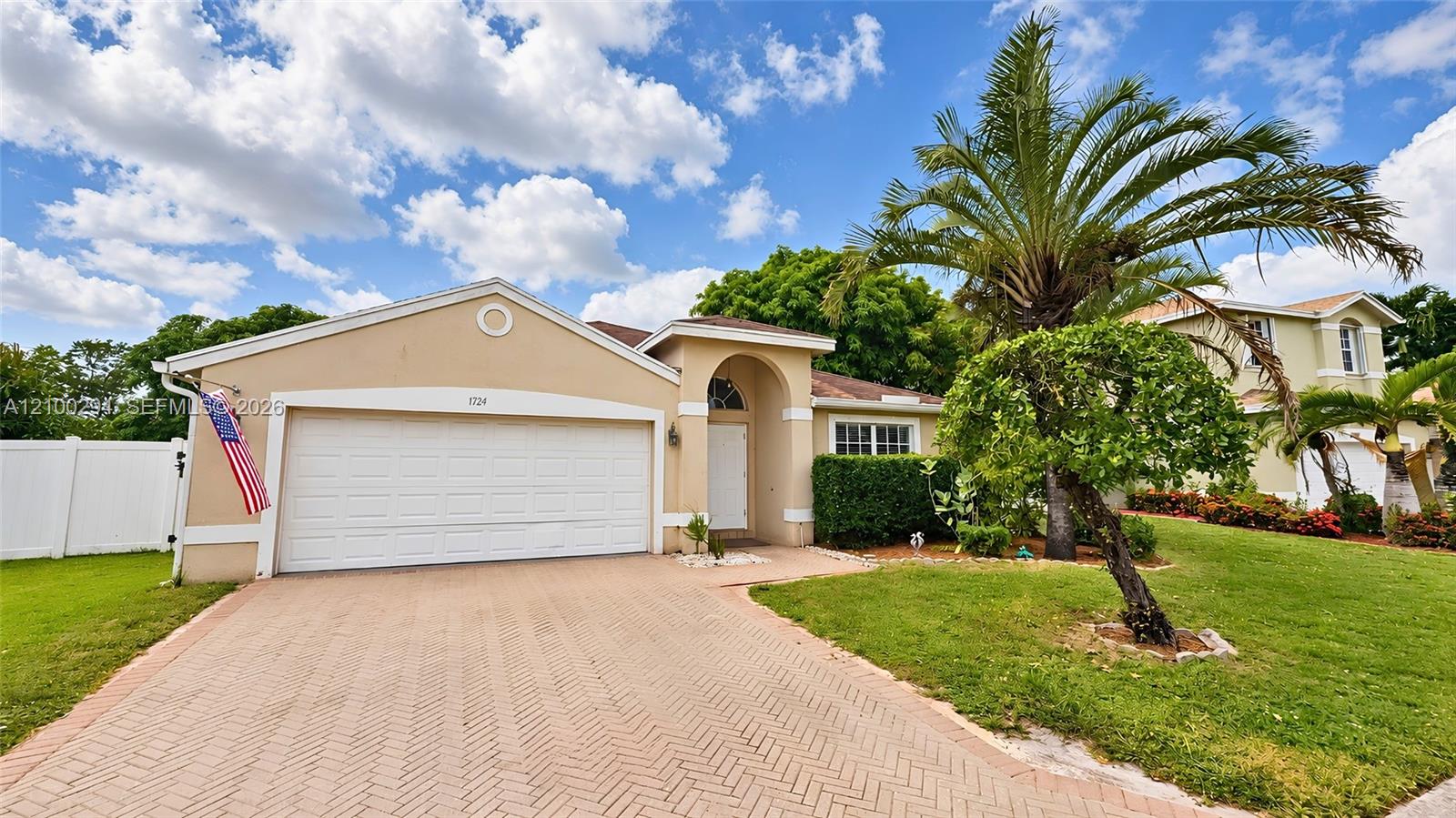 Single-story exterior paved 2 car garage Single-story exterior paved 2 car garage