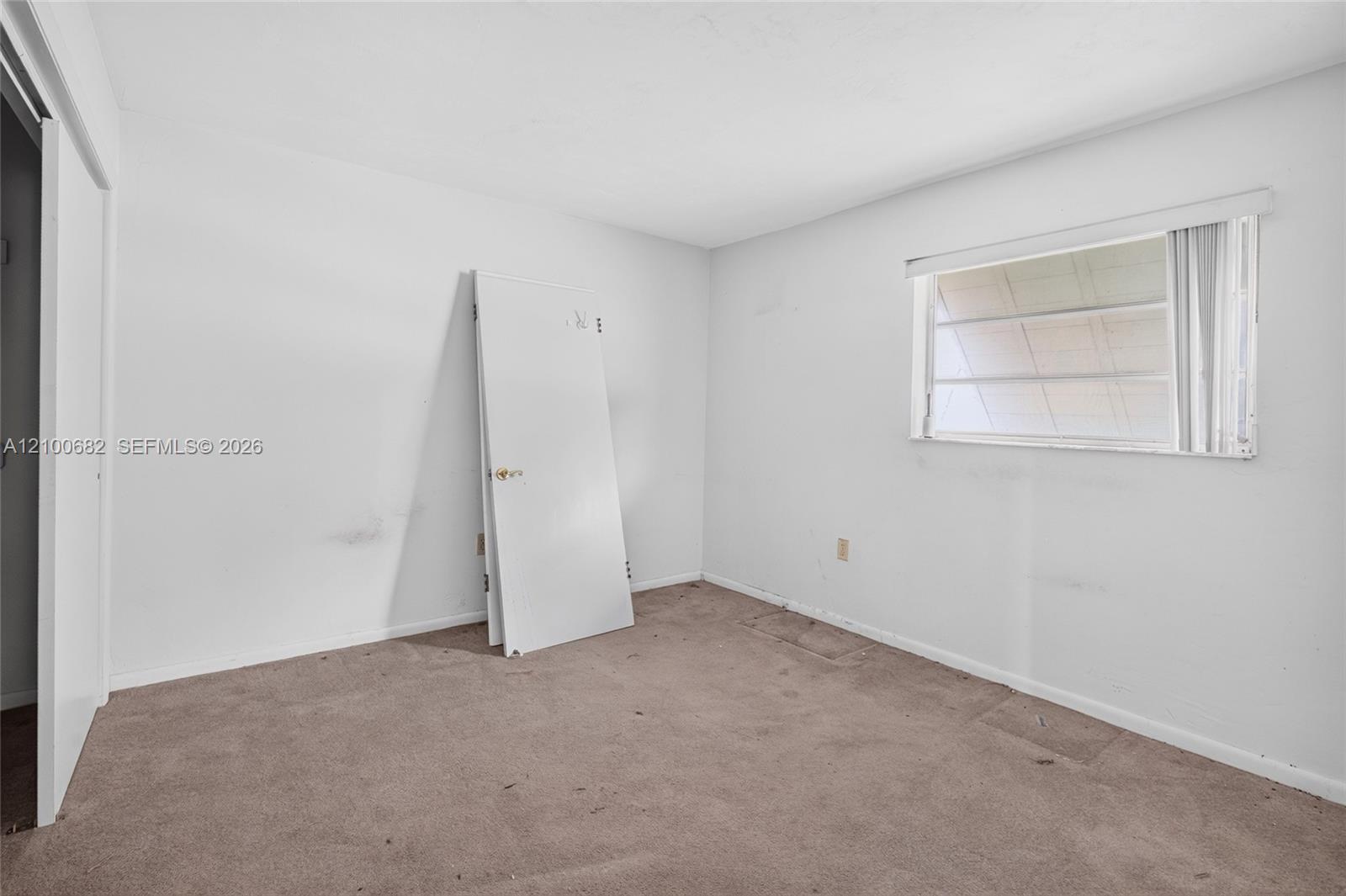One of the bedrooms where the new flooring has not been installed *