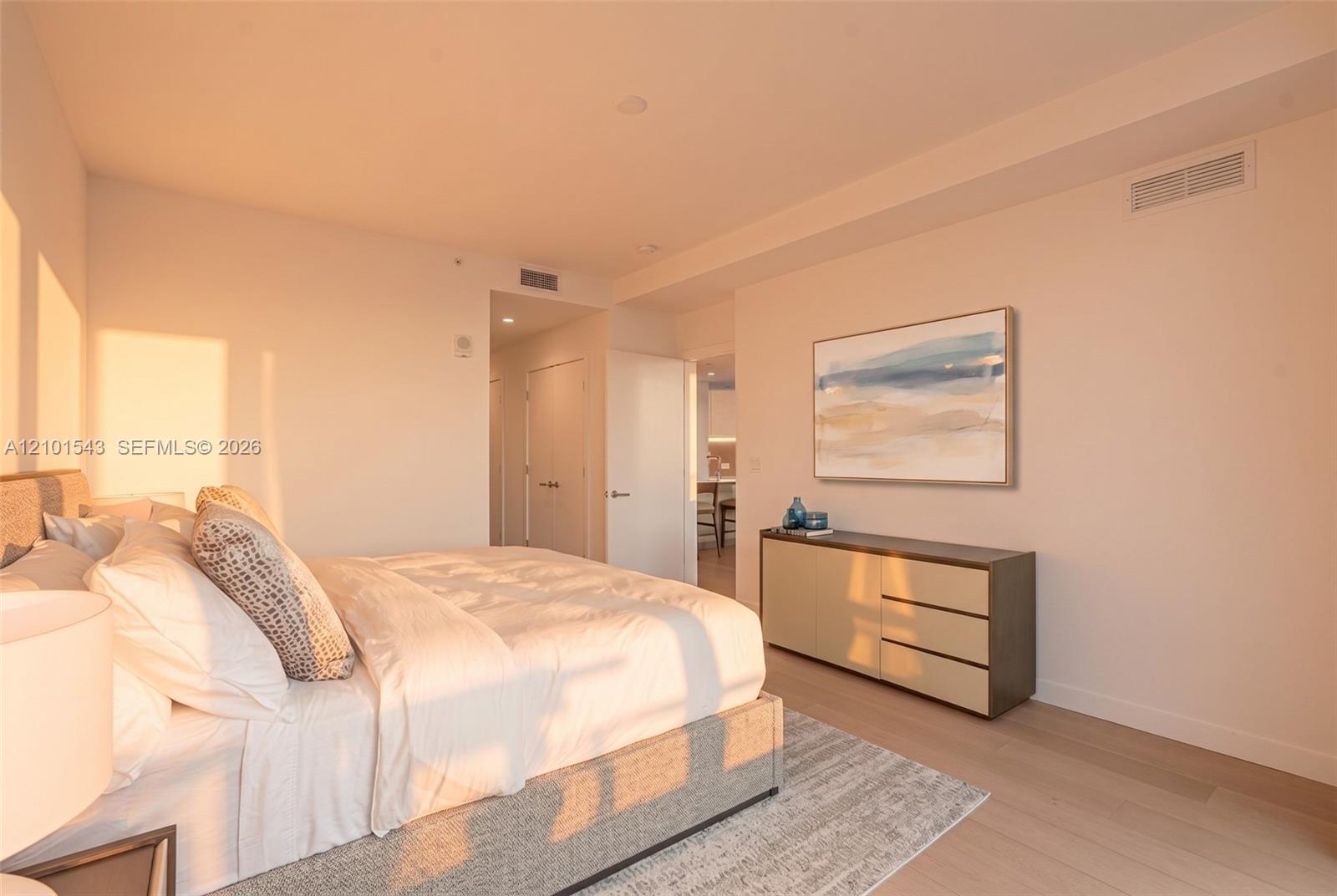 Neutral-toned interior featuring wood-finish flooring, recessed lighting, and crisp wall finishes
