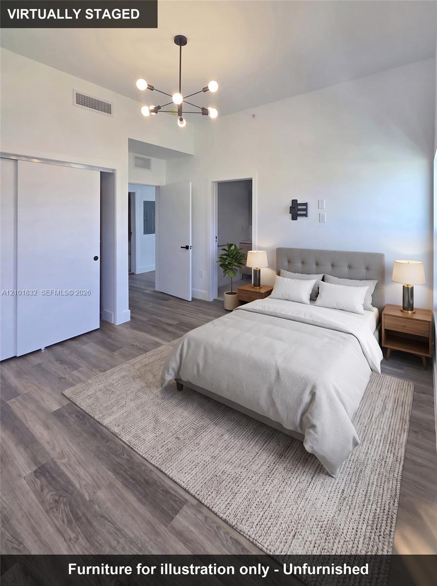 Wood-finish flooring, multi-arm geometric light fixture, and sliding door closet