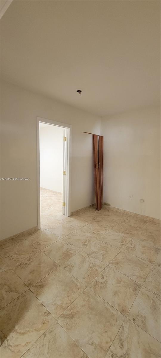 Neutral-toned stone-finish tile flooring throughout