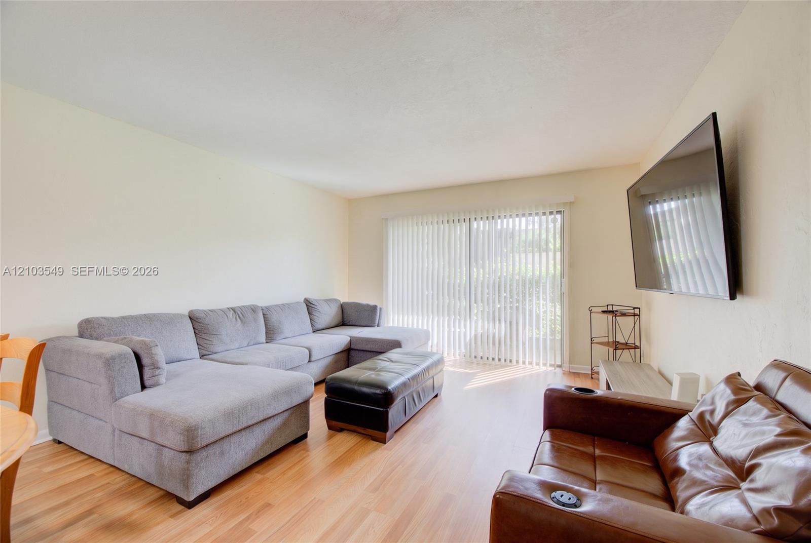 TV virtually rendered to show how Tenant can use existing wall mount.