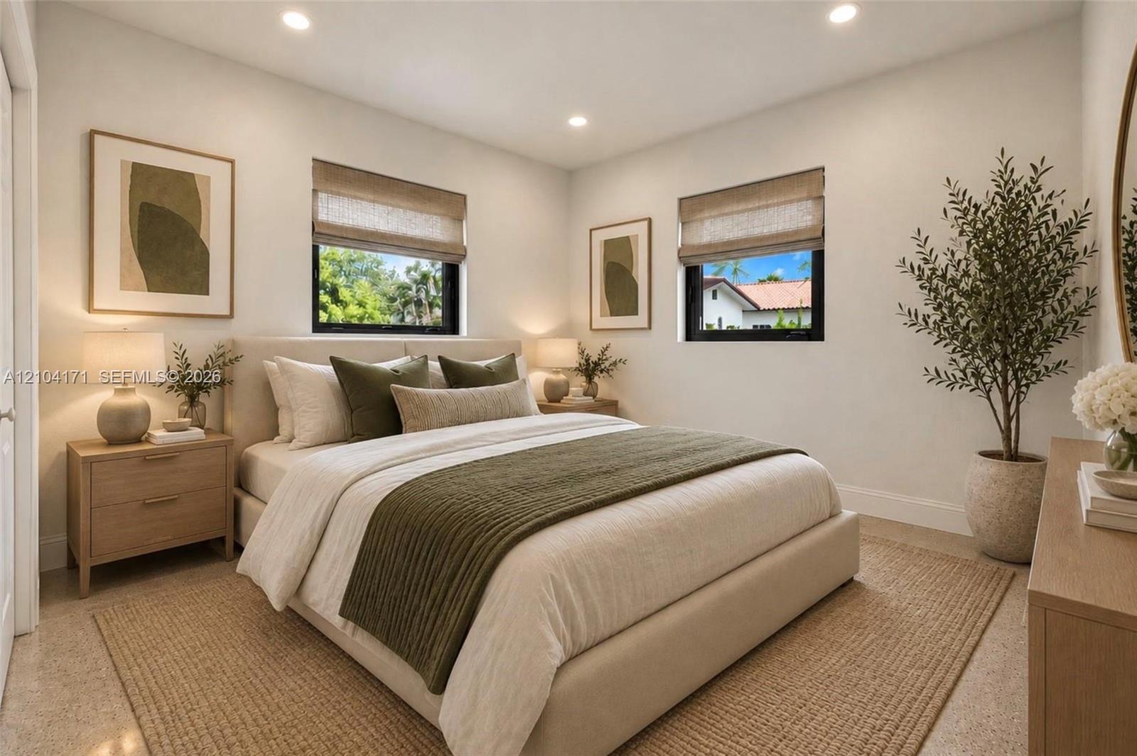Neutral-toned room featuring recessed lighting, dual windows with black frames, and light-toned hard-surface flooring