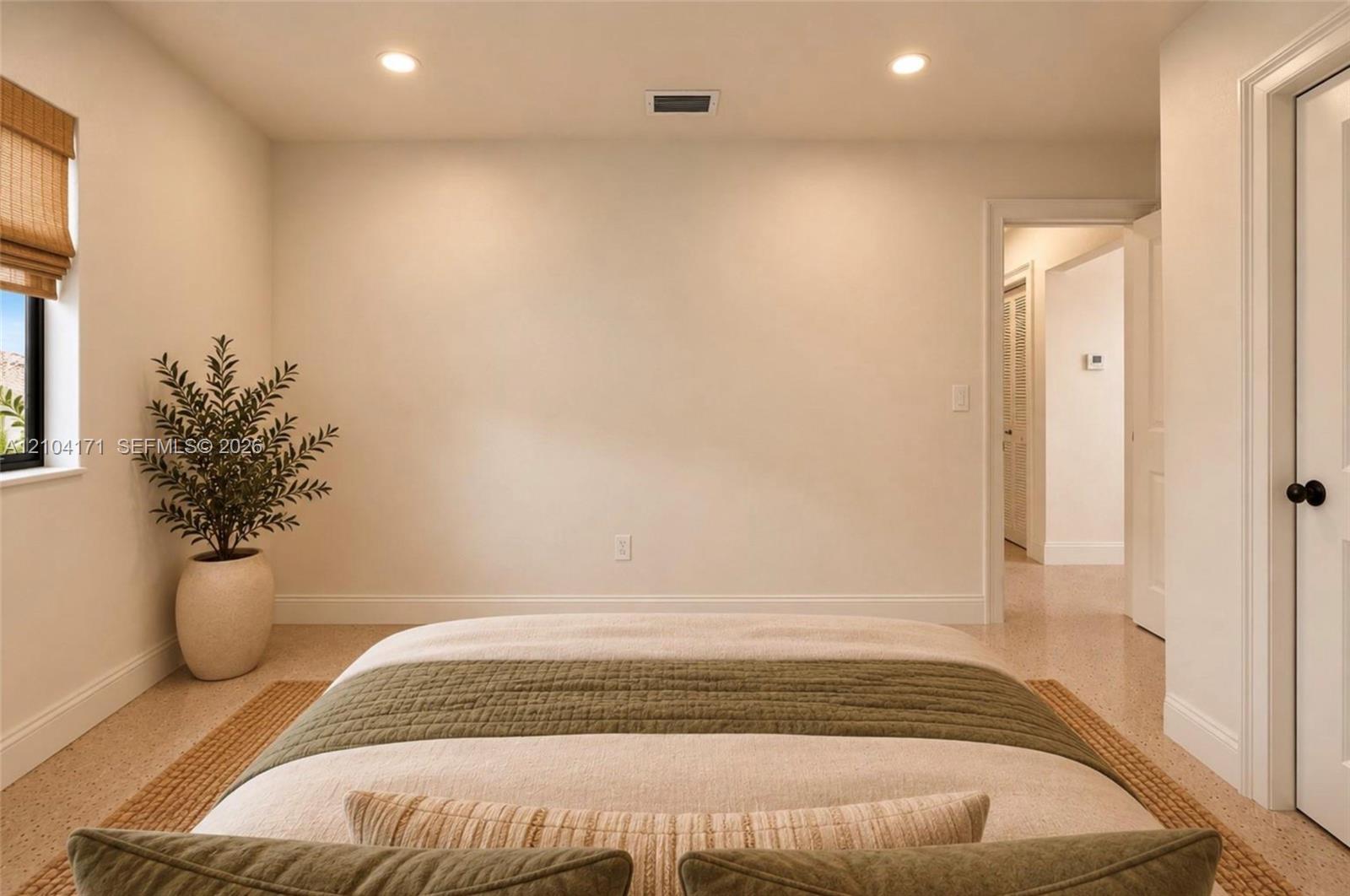 Neutral-toned room featuring recessed lighting, smooth walls, and neutral-toned flooring