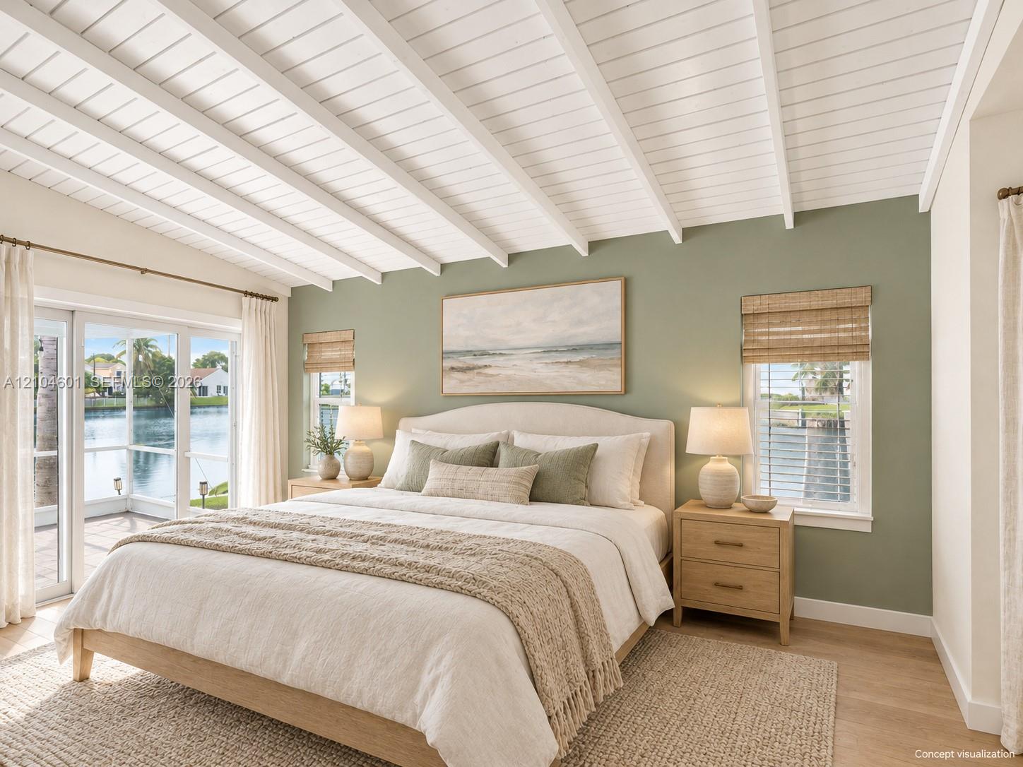 Vaulted ceiling with exposed white beams, wood-finish flooring, and sliding glass doors with direct access to an exterior patio