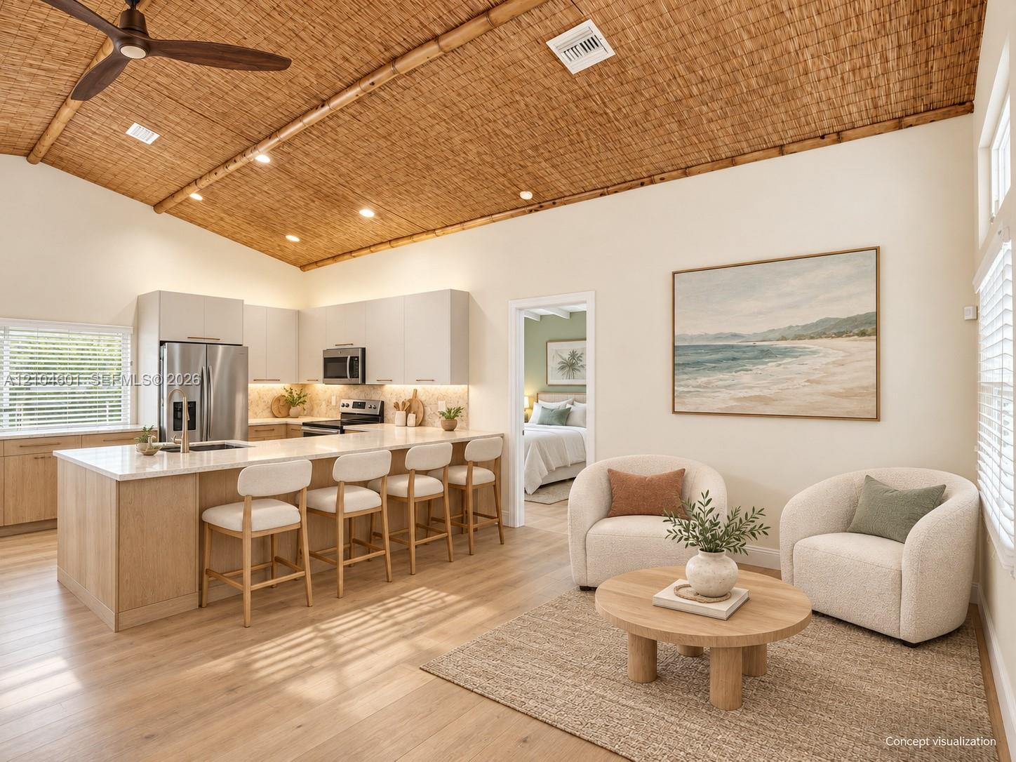Vaulted ceilings with woven natural texture, light-toned wood-finish flooring, and a kitchen island with stone countertops