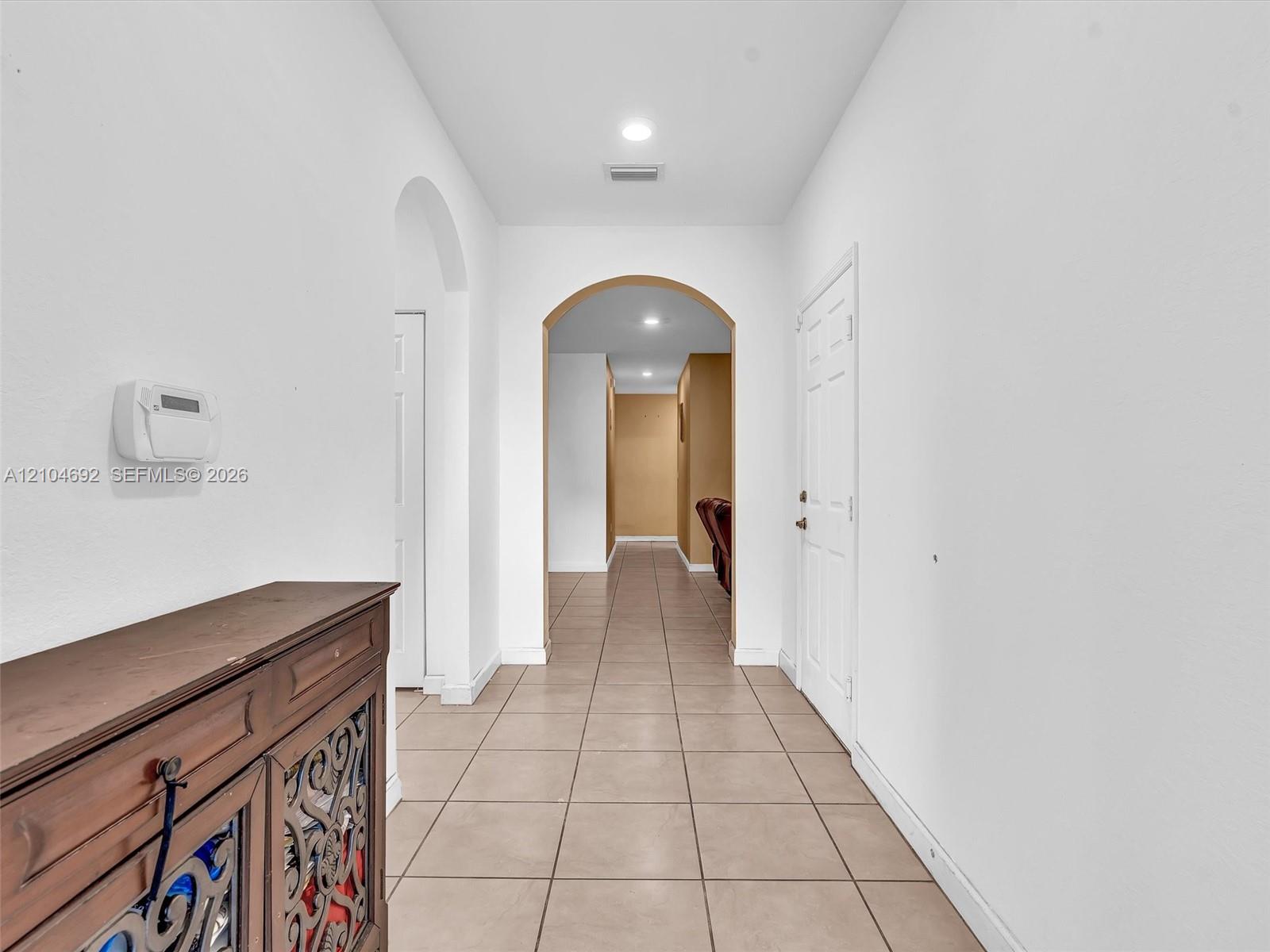 Ceramic tile flooring, arched entryways, and recessed lighting Ceramic tile flooring, arched entryways, and recessed lighting