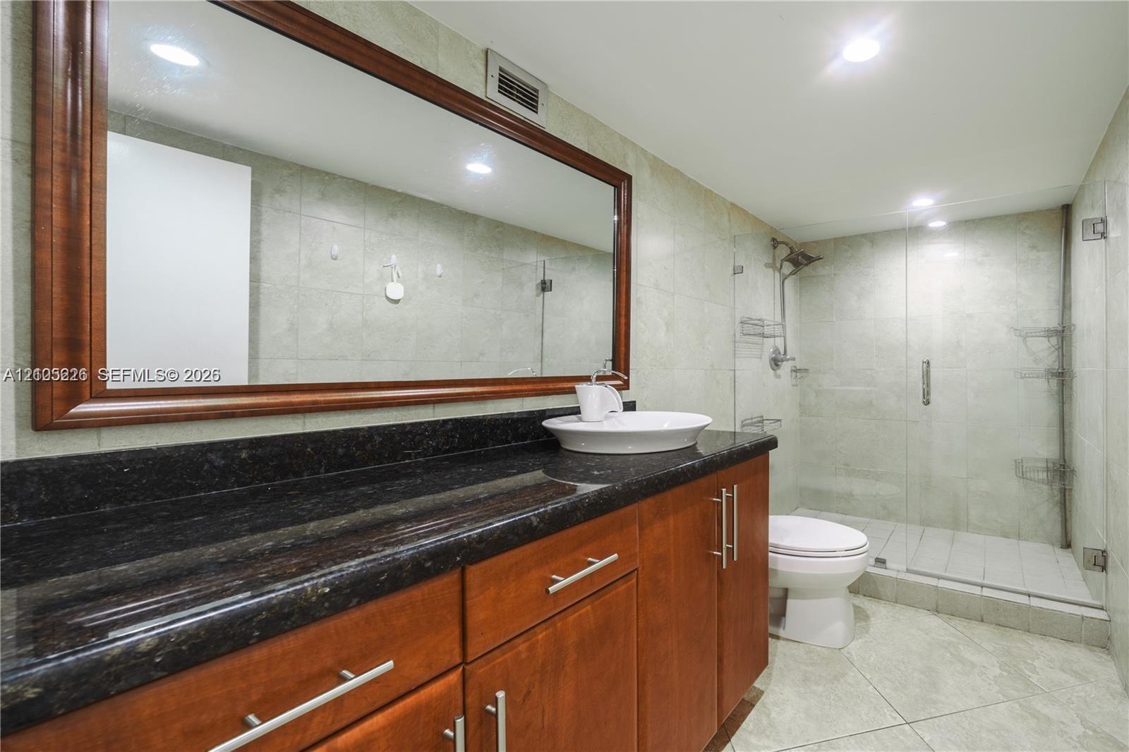 Tile flooring, crown molding, and window with built-in blinds