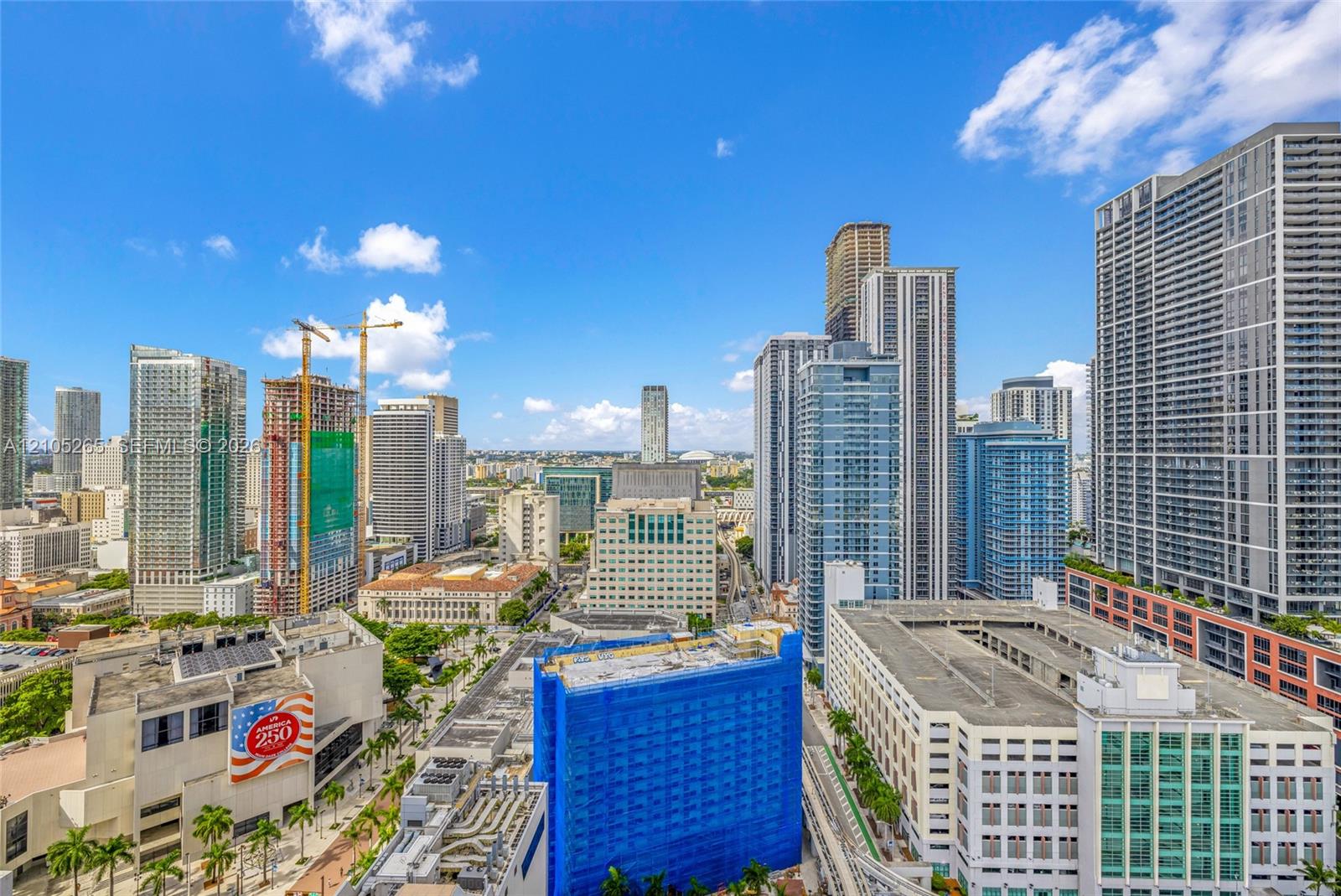 High-rise perspective featuring an expansive cityscape, glass-facade towers, and urban architectural density