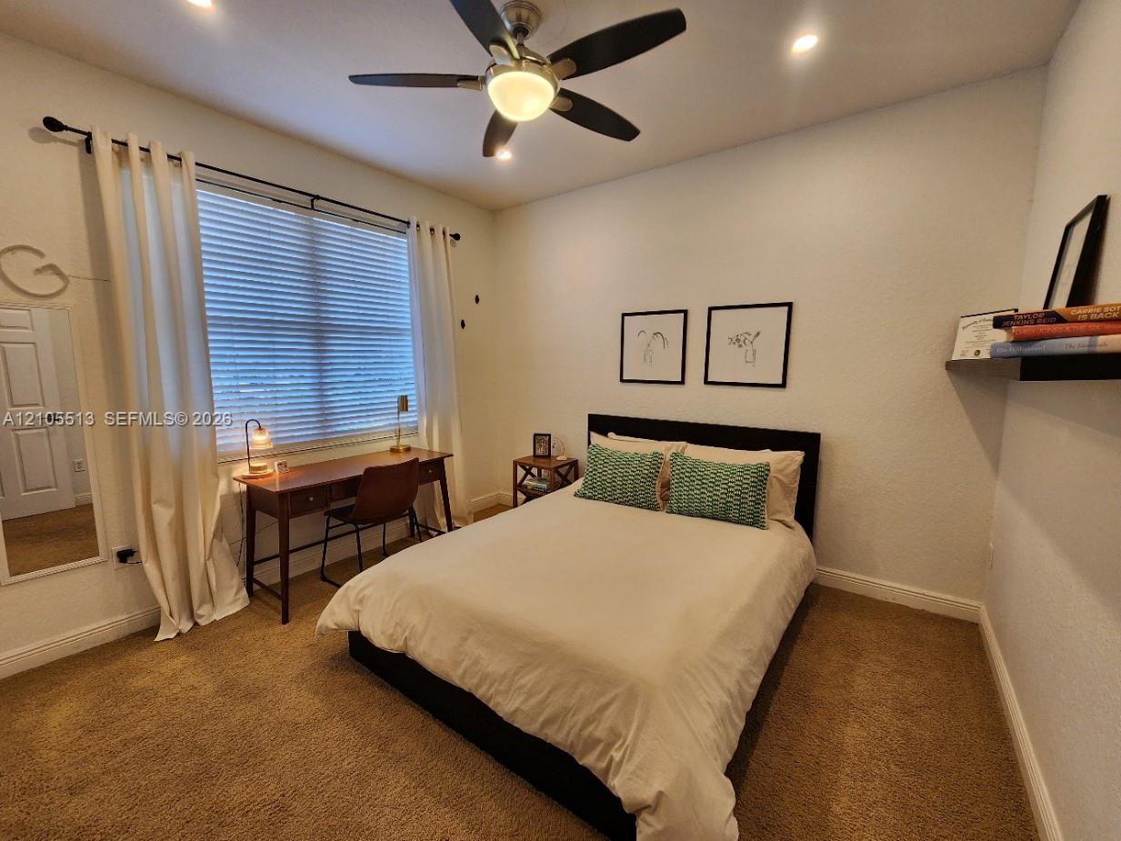 2nd Floor Guest Bedroom w/Recessed lighting, ceiling fan with light fixture, window with blinds, floating wall shelf, and carpet flooring
