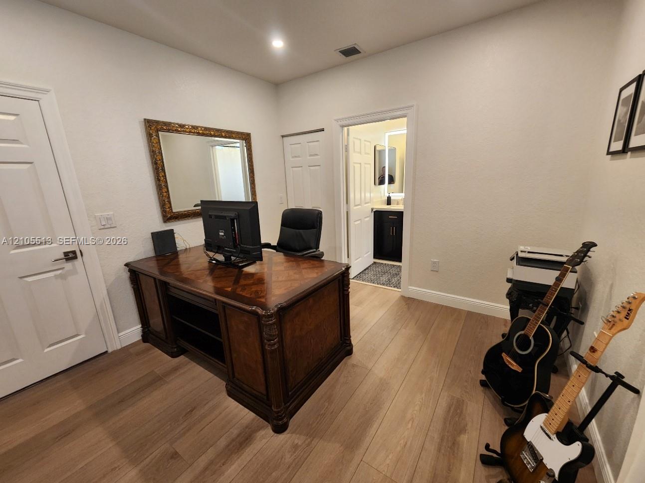 1st floor guest suite w/private bath (currently used as home office)