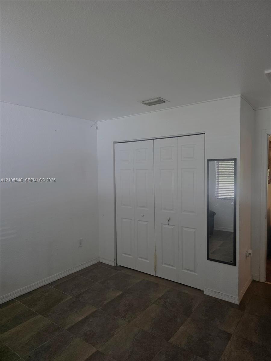 White bi-fold doors with panel detailing