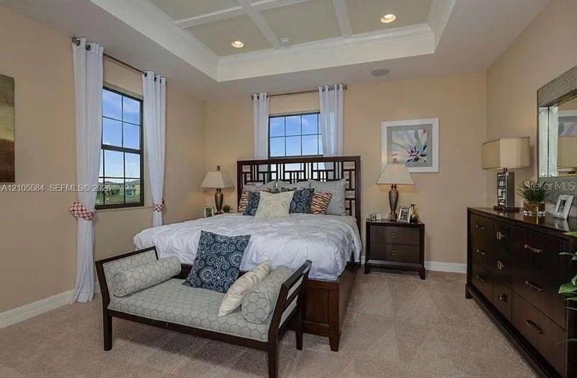 Tray ceiling with recessed lighting and grid-pattern window panes