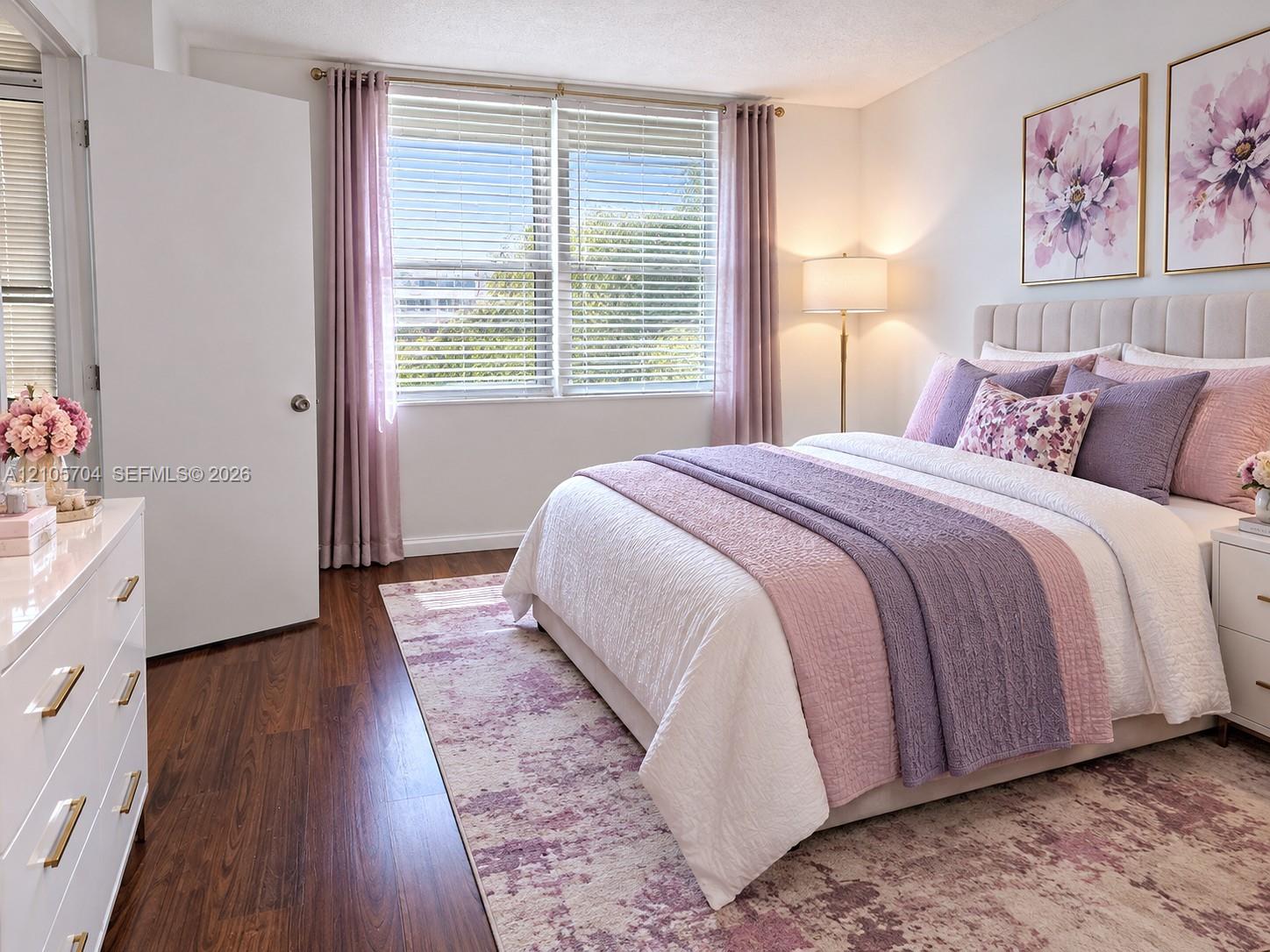 Wood-finish flooring, dual windows with horizontal blinds, and a solid-core interior door