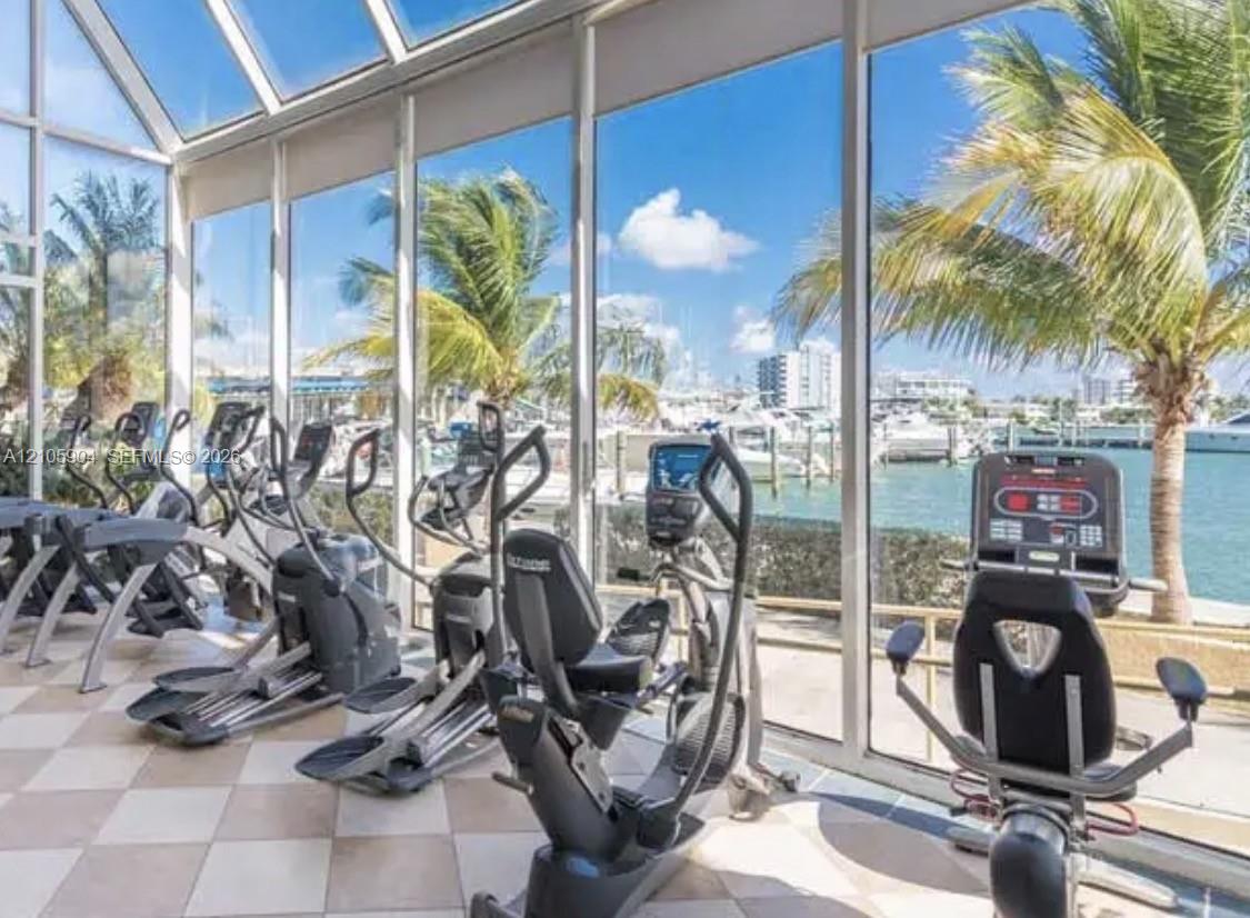 Floor-to-ceiling glass walls, expansive skylights, tile flooring, and direct maritime proximity Floor-to-ceiling glass walls, expansive skylights, tile flooring, and direct maritime proximity